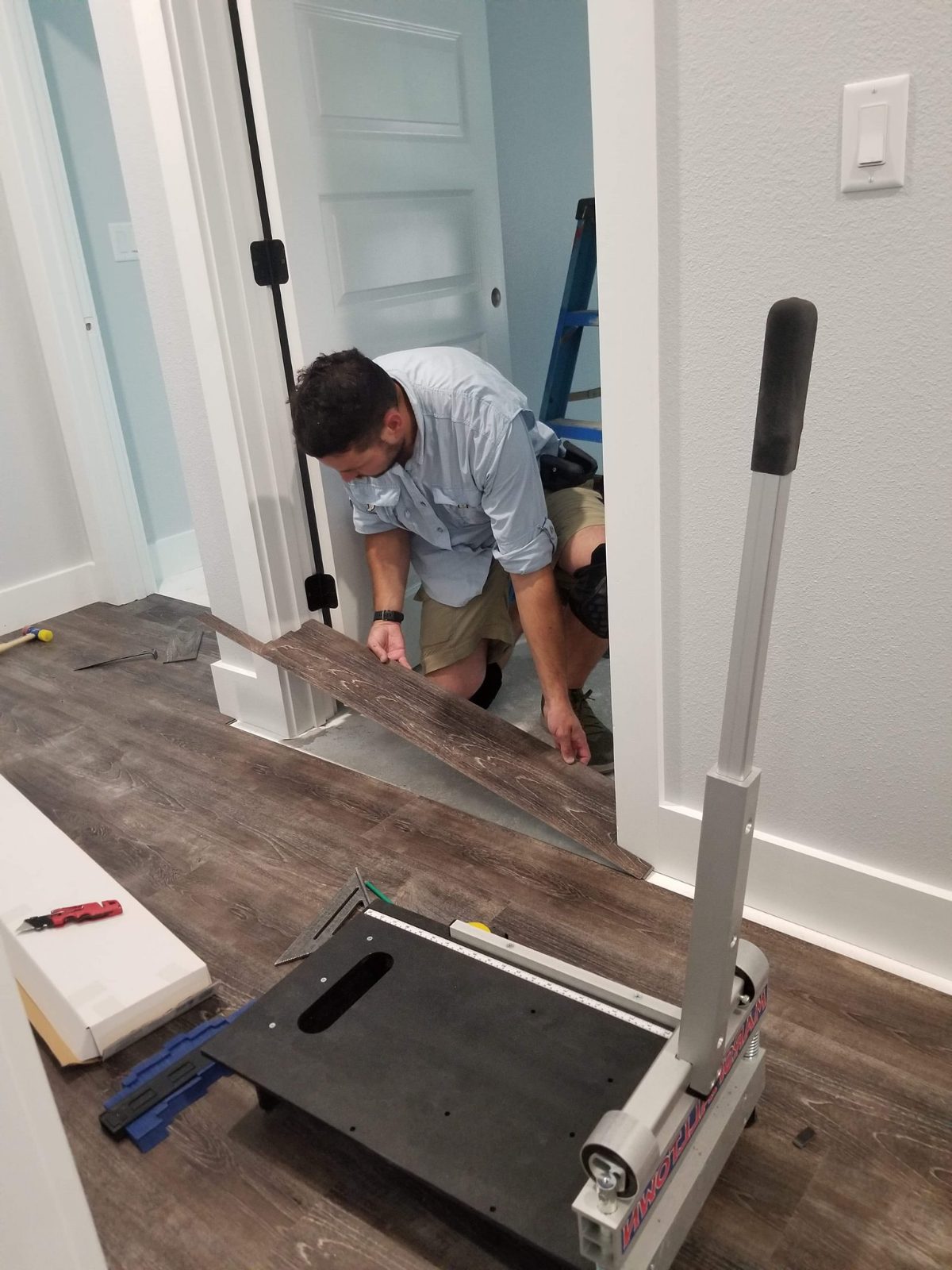 David of Schaffers Construction installing flooring
